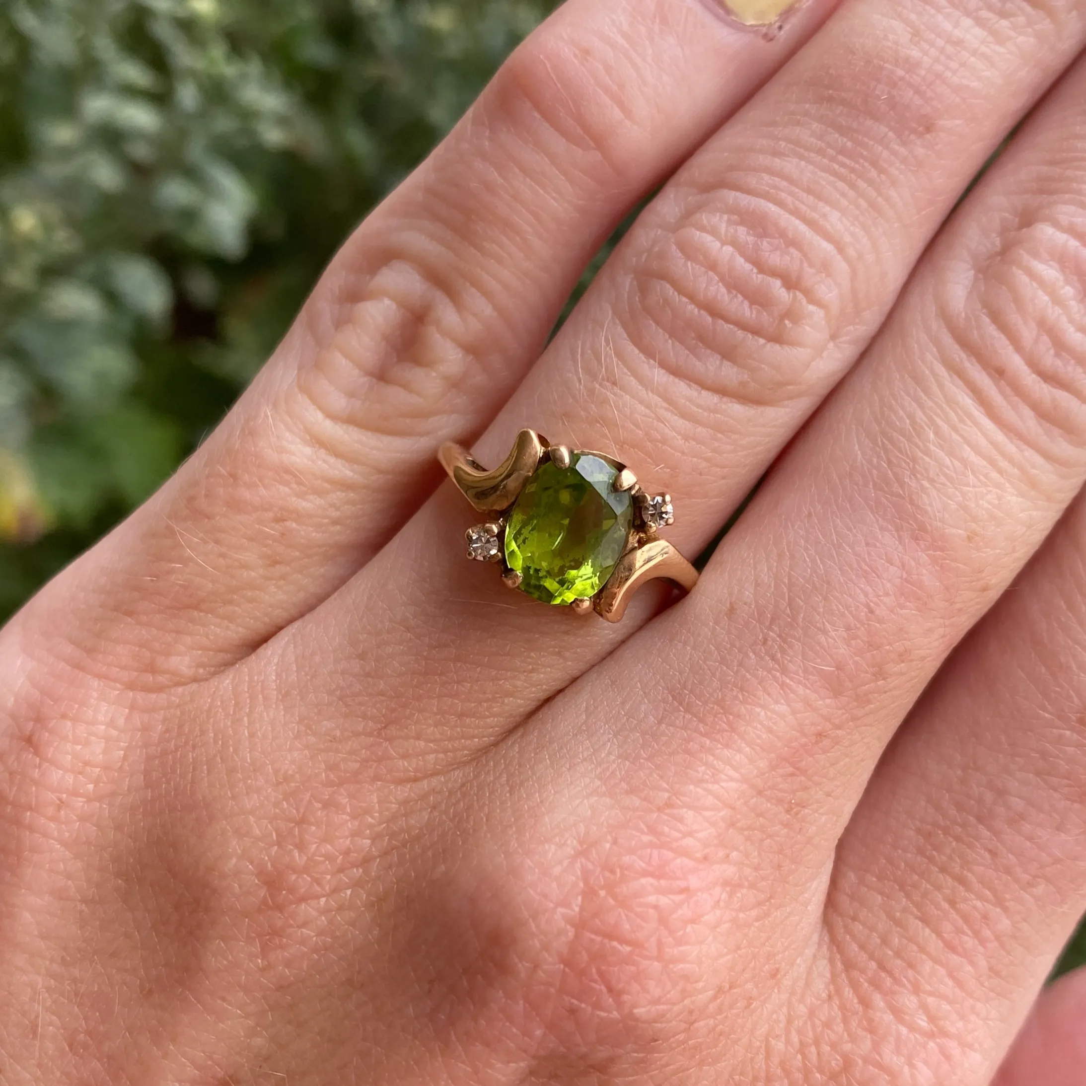 14k Oval Cut Peridot with Two Diamonds Ring