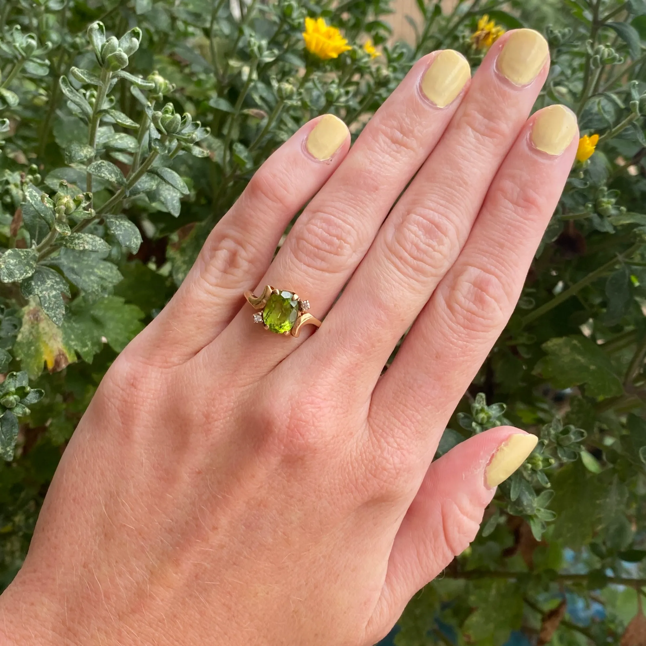 14k Oval Cut Peridot with Two Diamonds Ring