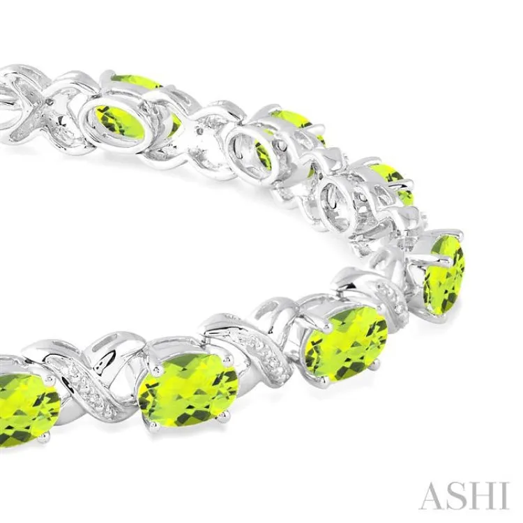 7x5 mm Oval Cut Peridot and 1/20 Ctw Round Cut Diamond Fashion Bracelet in Sterling Silver