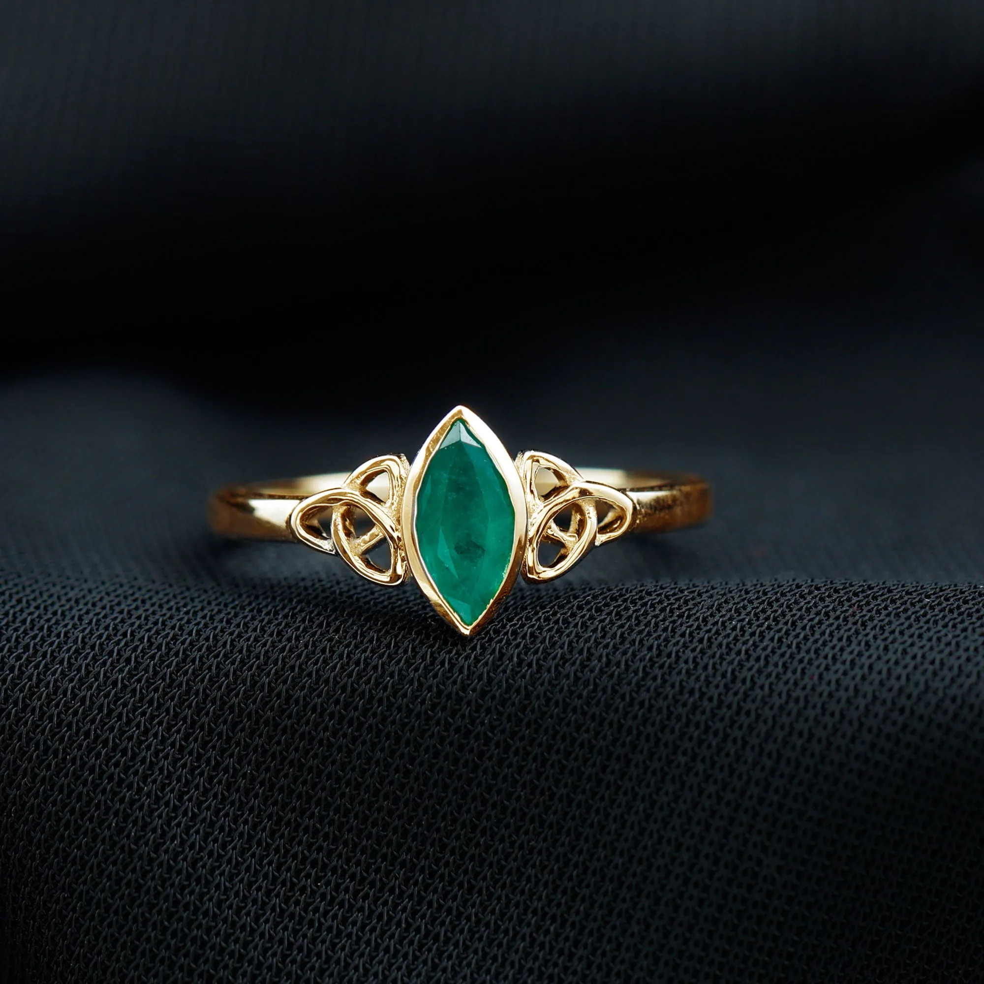 Marquise Cut Emerald Solitaire Celtic Ring in Bezel Setting