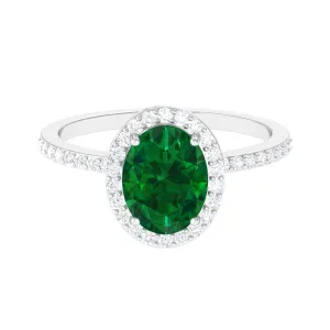 Oval Cut Created Emerald and Diamond Halo Engagement Ring