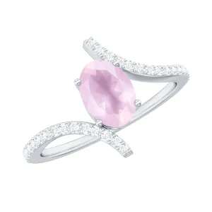 Oval Rose Quartz Solitaire Bypass Engagement Ring with Diamond