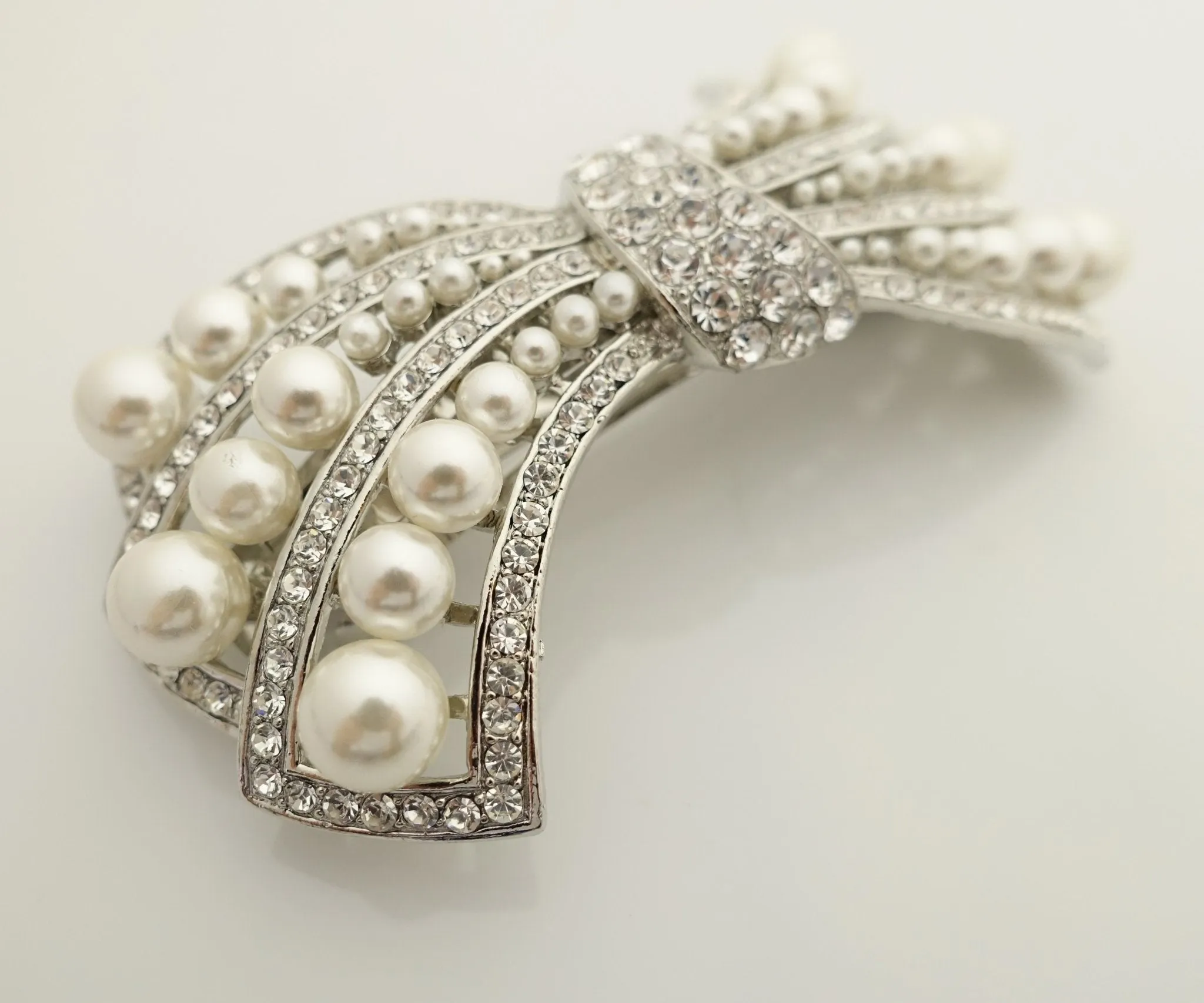 pearl rhinestone decorated leaf wave bow french barrette