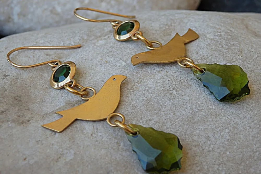 Pigeon gold dangle earrings