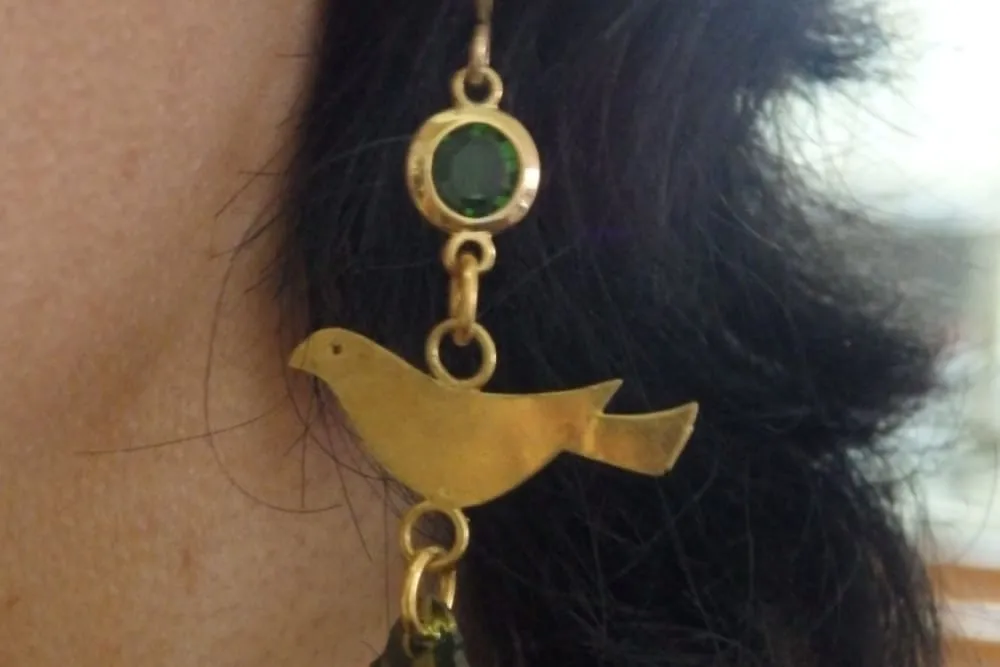 Pigeon gold dangle earrings